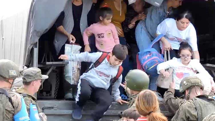 Thousands of Armenians in Karabakh mass at airport after ceasefire deal