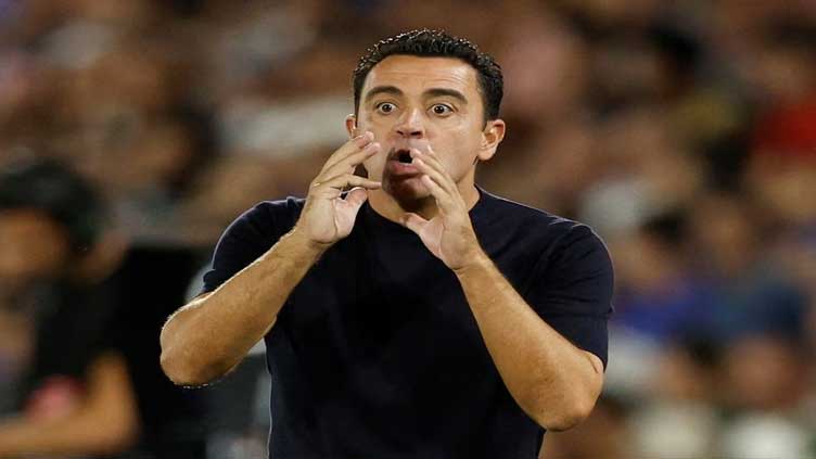 Xavi signs contract extension with Barcelona until 2025