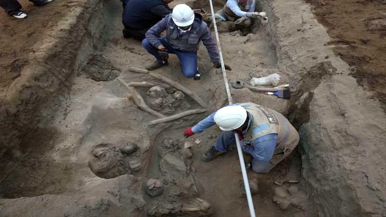 Workers uncover eight mummies in Peru