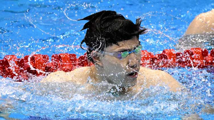 Breaststroke king Qin fires Asian Games warning