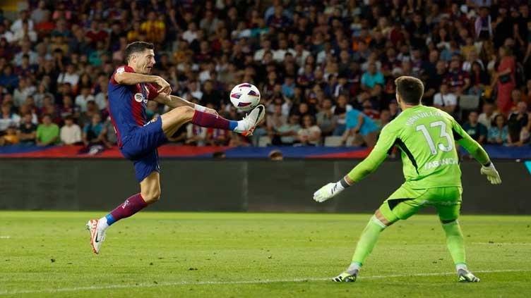 Lewandowski and Cancelo strike as Barca snatch 3-2 win over Celta