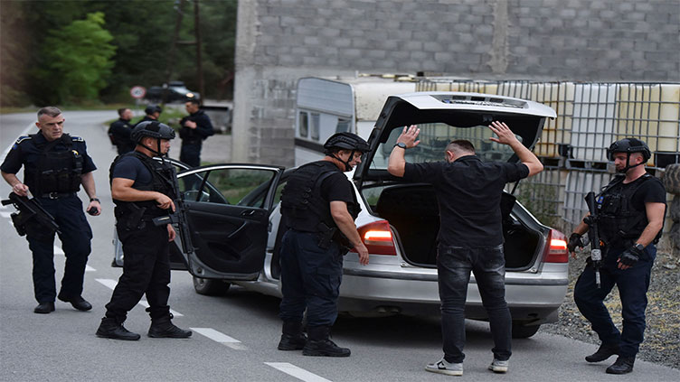 Serb gunmen battle police in Kosovo monastery siege; four dead