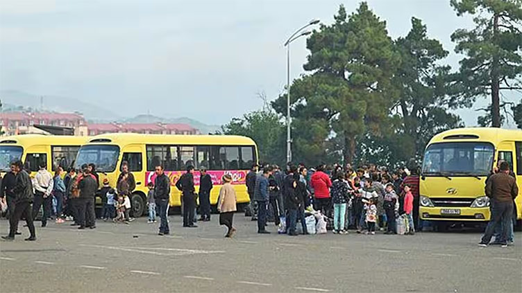 Ethnic Armenians flee Karabakh after breakaway region's defeat