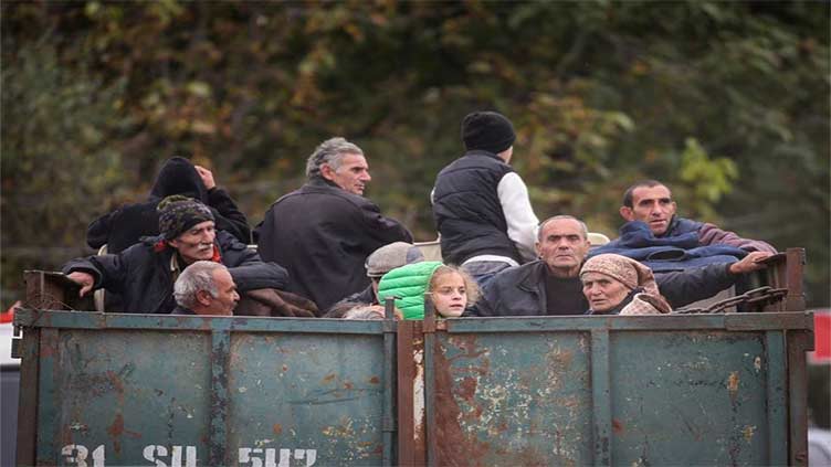 Tens of thousands of ethnic Armenians rush to flee Nagorno-Karabakh