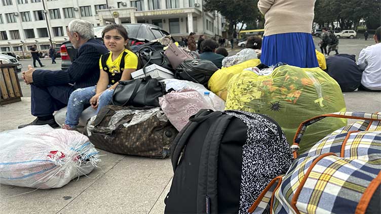 Nagorno-Karabakh announces dissolution as more than 75,000 flee separatist enclave