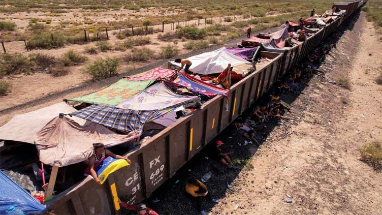 Migrants aboard Mexico cargo trains stranded miles from US border