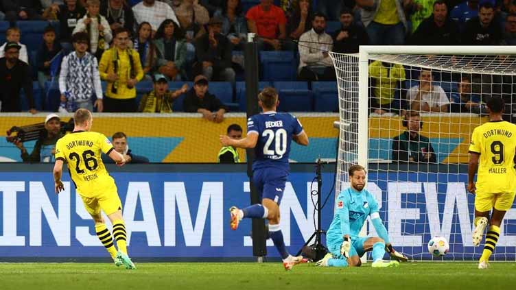 Ten-man Dortmund beat Hoffenheim 3-1 to take over top spot