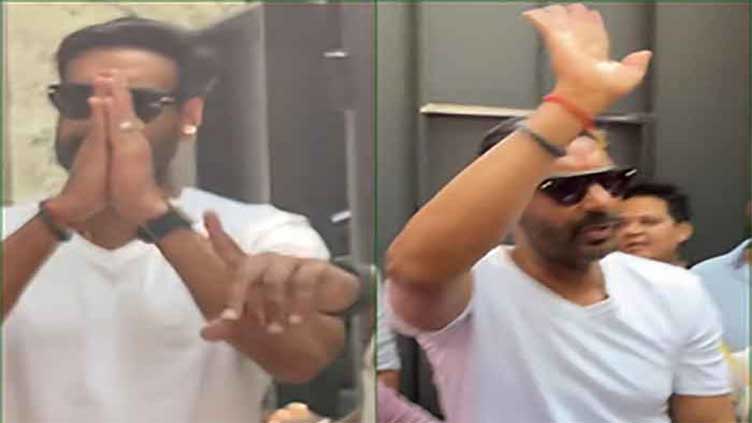 Ajay Devgn greets fans outside his residence on 55th birthday