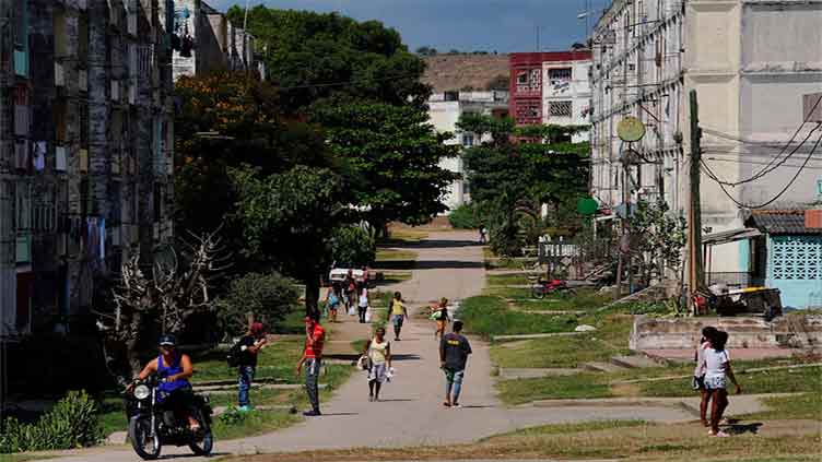 Cuba guarantees food rations in bid to defuse tension after protests