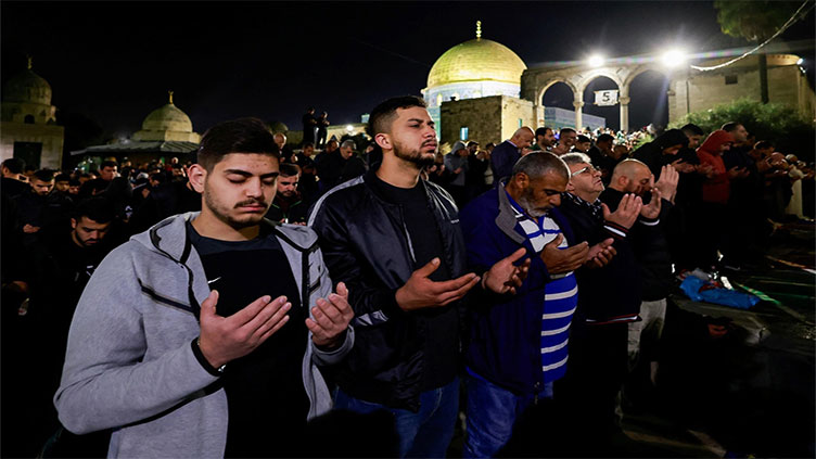 Palestinian Muslims mark sad and tense 'holiest Ramazan night' in Jerusalem
