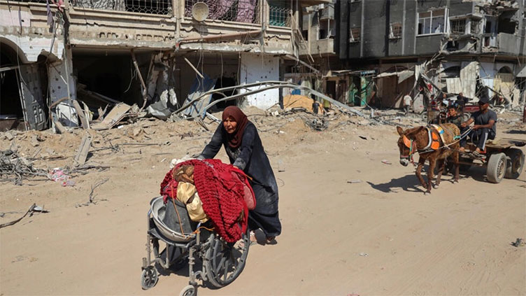 'It smells like death': Gazans return to devastated Khan Yunis