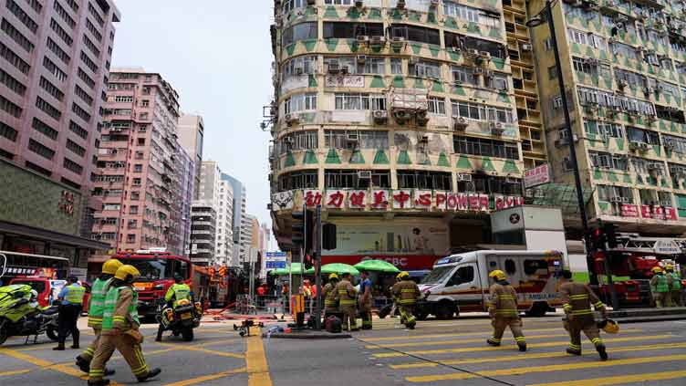 Fire in packed Hong Kong building kills five, dozens in hospital