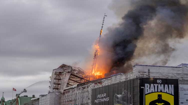 Spire collapses as historic Borsen engulfed in flames