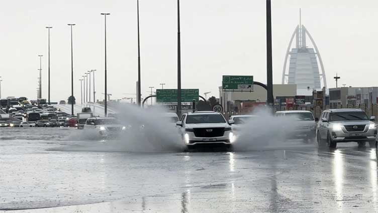 A storm dumps record rain across the desert nation of UAE and floods Dubai's airport