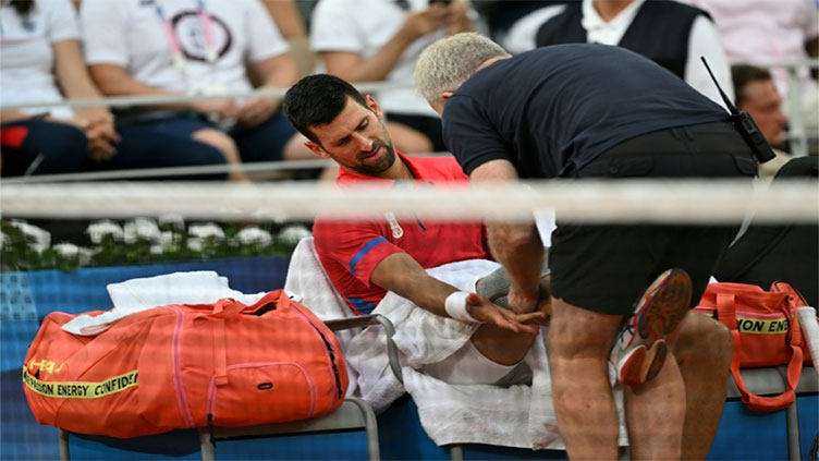 Djokovic survives injury scare to reach Olympics semi-finals