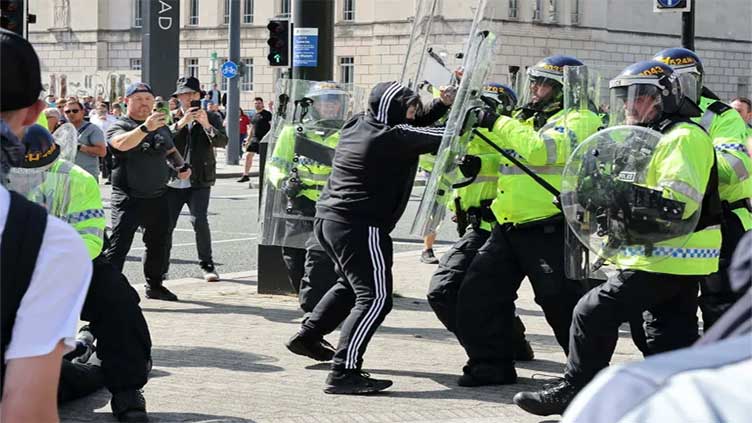 Far-right protesters clash with police in UK cities as unrest spreads