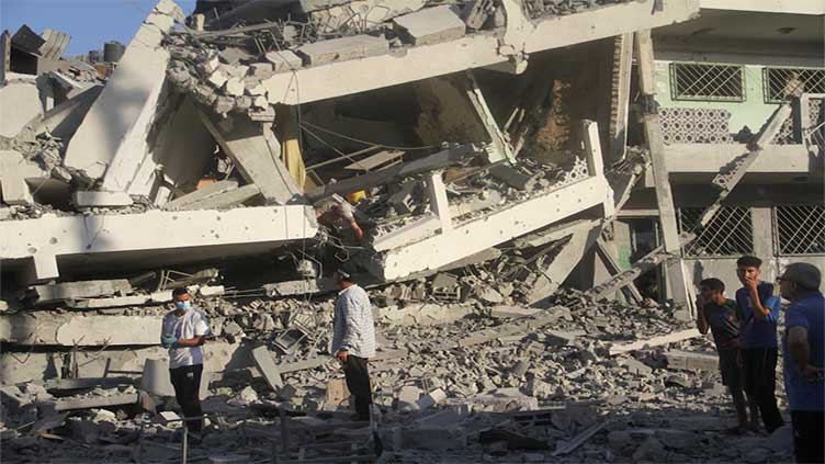 Israeli strikes kill 15 Palestinians in Gaza school, nine fighters in West Bank