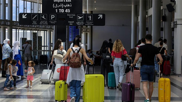 Travellers rush to leave Lebanon amid spiking tensions, cancelled flights