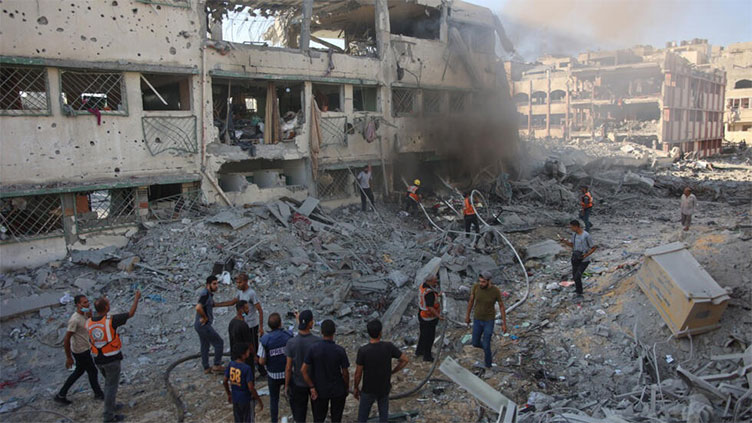 Gaza civil defence says Israel strike on schools kills 30