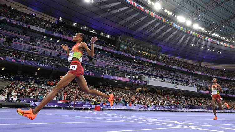 Kenya's 'smiling assassin' Chebet wins Olympic 5,000m gold