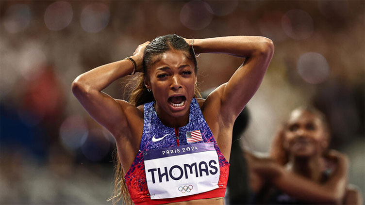 Thomas takes Olympic 200m, Hocker streaks to shock 1500m victory