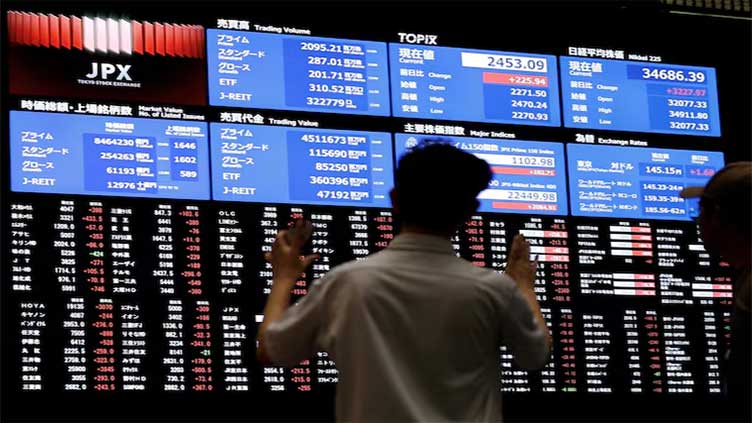 Asia stocks wobble as tech drags, yen gains in volatile trade