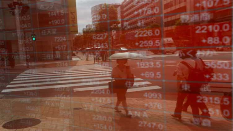 Asian shares to end tough week on a high