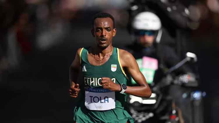 Ethiopia's Tola storms to men's marathon gold as Kipchoge drops out