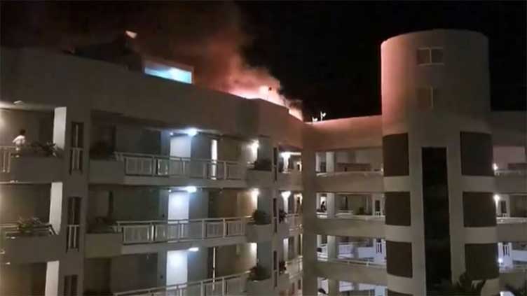 Helicopter crashes into roof of Cairns Hilton Double Tree hotel, killing pilot