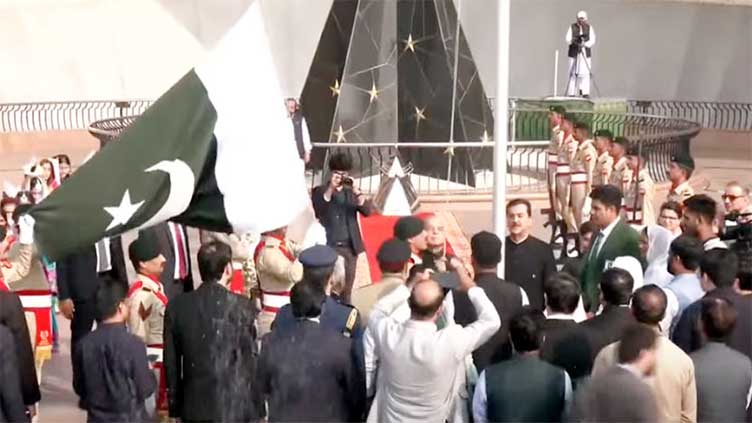 PM hoists national flag, promises five-year economic plan to bring country back on its feet