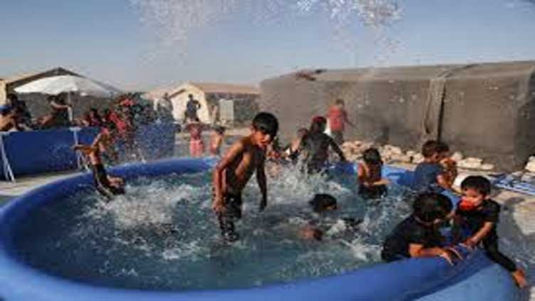 Mobile pools offer relief from heat to children in north Syria camps