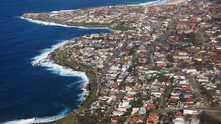 Australian homeowners struggling to afford insurance as climate risks grow, report says