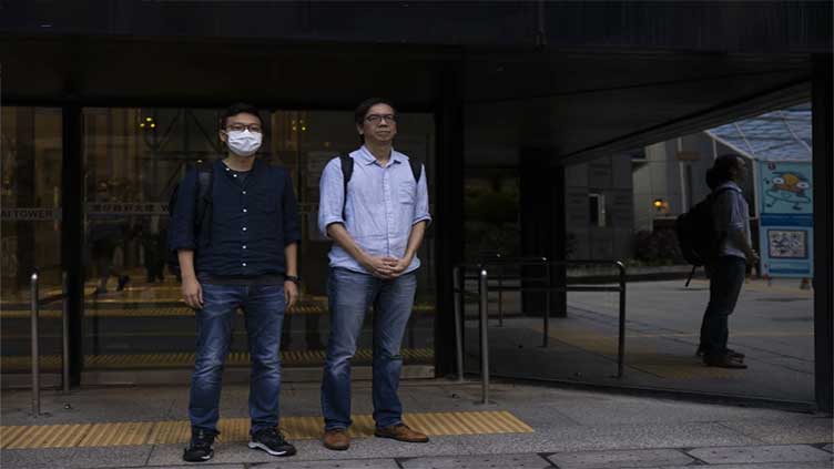 A Hong Kong court convicts 2 journalists in a landmark sedition case