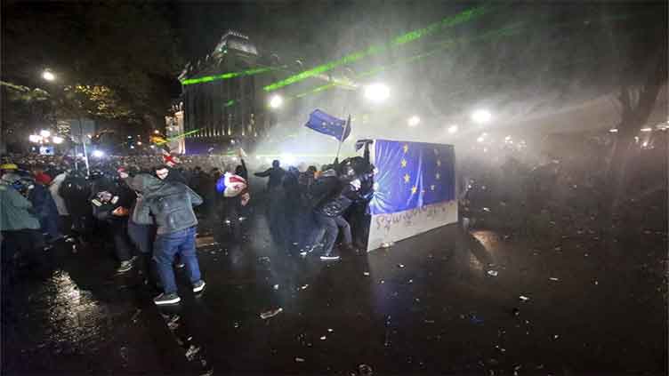 Georgian protesters clash with police for a second night after EU talks are suspended