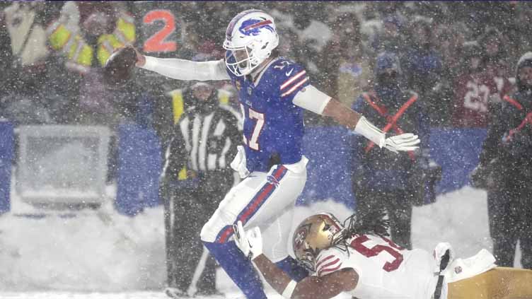 Josh Allen has TDs passing, rushing and receiving as Bills rout 49ers 35-10 in snow, clinch AFC East