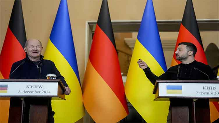 German leader Scholz vows more Ukraine aid and defends his phone call with Putin