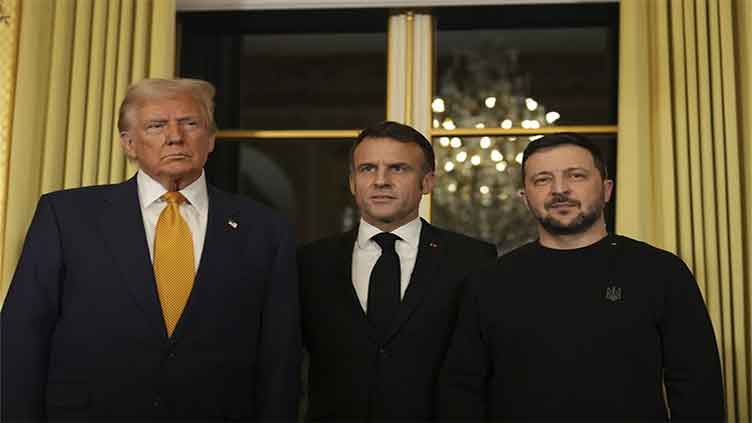 Trump is welcomed by Macron to Paris with presidential pomp and joined by Zelenskyy for their talks