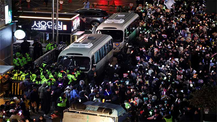 South Korea police raid Yoon's office over martial law as ousted minister attempts suicide