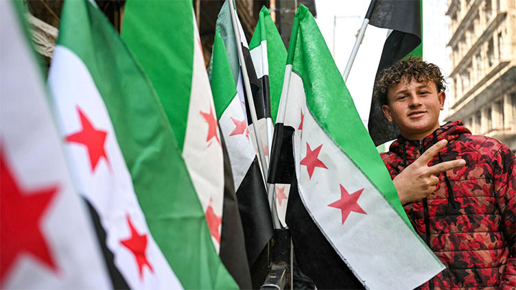 Syrians bring back independence flag with Assad's ouster