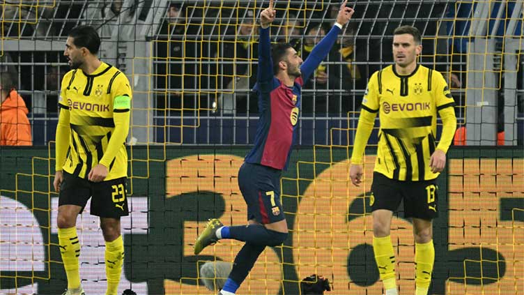 Torres sinks Dortmund to send Barcelona into knockouts