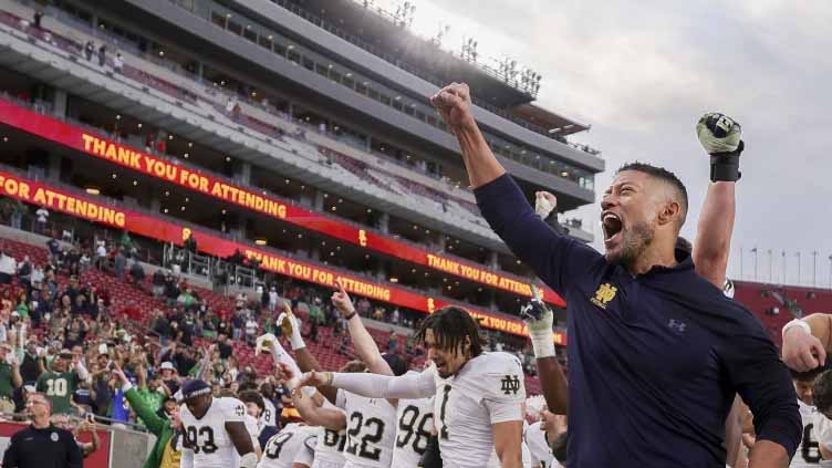 Notre Dame and Indiana get 1st taste of playoff football under the Friday night lights