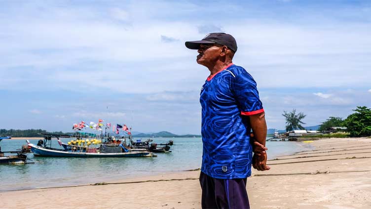 Twenty years after Indian Ocean tsunami, Thai ex-fisherman stands at the ready