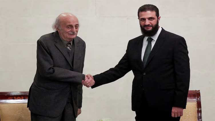 Syria's de facto ruler reassures minorities, meets Lebanese Druze leader