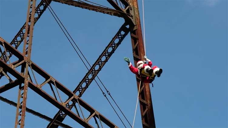 Santa rappels down to bring Christmas cheer to Guatemalan children