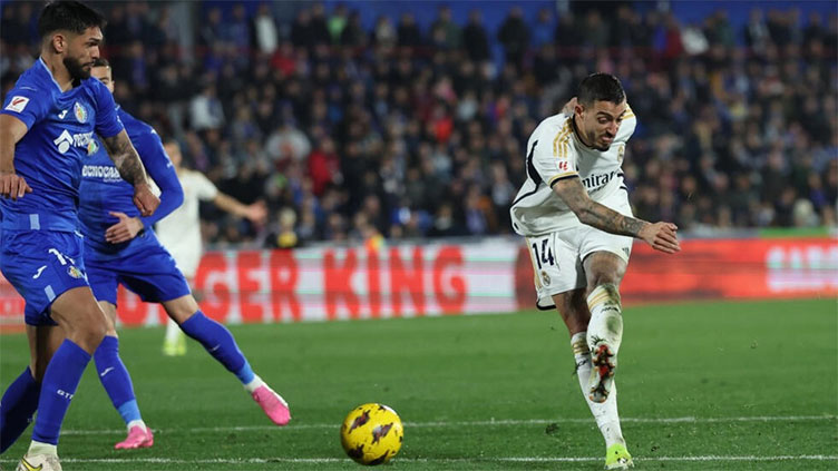 Joselu double sends Madrid top at Getafe