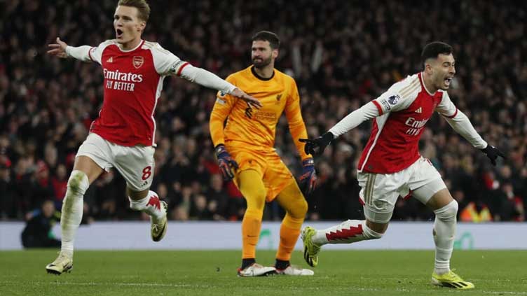 Alisson blunder helps Arsenal rock Liverpool as title race ignites