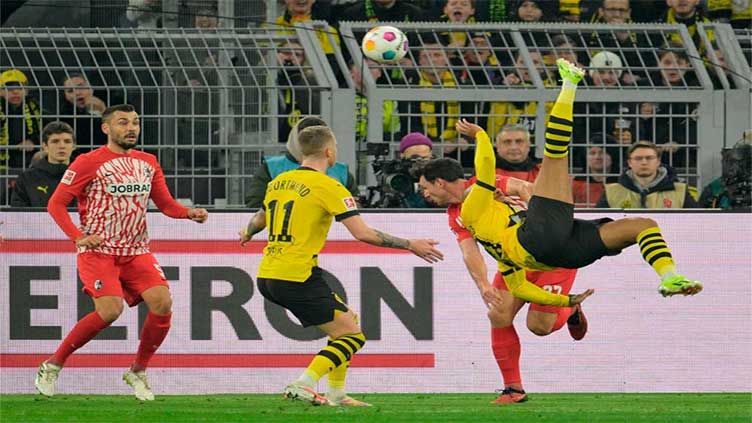 Malen double fires Dortmund past Freiburg