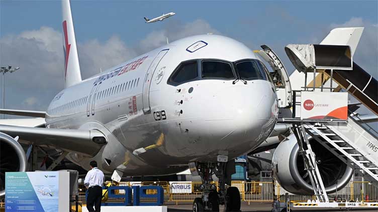 Made-in-China airliner seeks buyers at Singapore Airshow