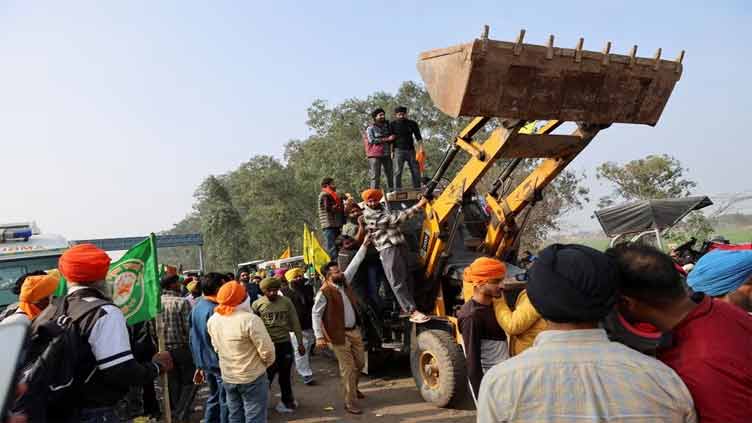 With cranes and excavators, Indian farmers prepare to march on capital