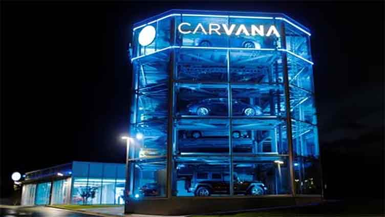 Carvana shares ride higher after first annual profit